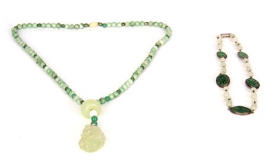 Lot 114 - TWO CHINESE JADE AND SILVER NECKLACES one with...