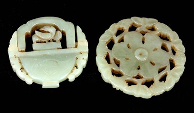 Lot 123 - TWO CHINESE CARVED JADE PI DISCS one formed as...