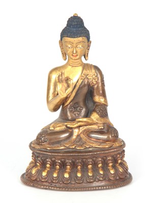 Lot 167 - AN EARLY GILT BRONZE SEATED BUDDHA having gilt...