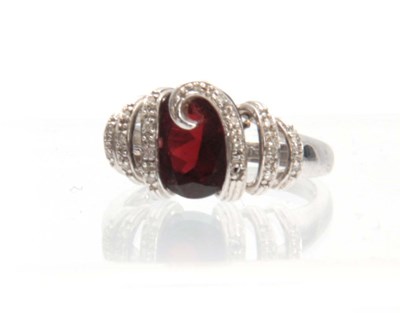 Lot 226 - A 14ct WHITE GOLD, RUBY AND DIAMOND RING...