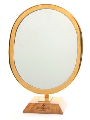 Lot 233 - A VINTAGE PATEK PHILIPPE SHOP MIRROR the brass...