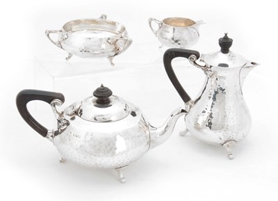 Lot 250 - A SILVER ARTS & CRAFTS DESIGN FOUR-PIECE TEA...