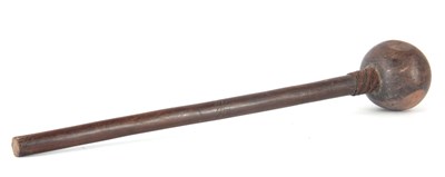 Lot 327 - AN AFRICAN HARDWOOD CLUB with a large bulbous...