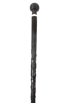 Lot 347 - A 19TH CENTURY IRISH BOG OAK WALKING CANE with...