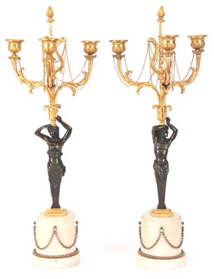 Lot 373 - A FINE PAIR OF REGENCY BRONZE AND ORMOLU THREE...