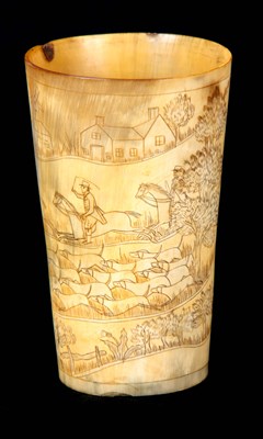 Lot 651 - A GEORGIAN CARVED HORN BEAKER WITH HUNTING SCENE