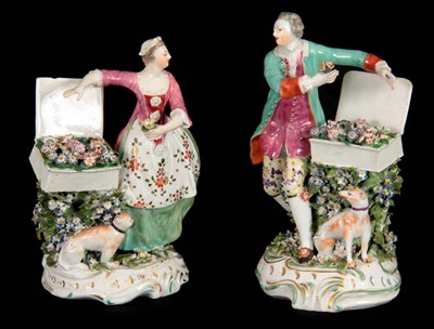 Lot 47 - A PAIR OF DERBY FLOWER SELLER FIGURE GROUPS...