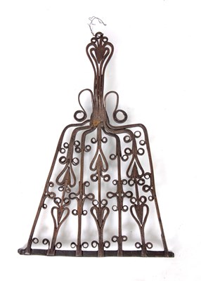 Lot 561 - AN 18TH CENTURY IRONWORK TRIVET with heart and...