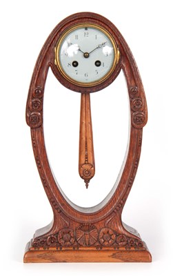 Lot 829 - A STYLISH OAK CASED ART NOUVEAU MANTEL CLOCK...