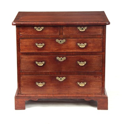 Lot 896 - A GEORGE II WALNUT CHEST OF DRAWERS with cross-...