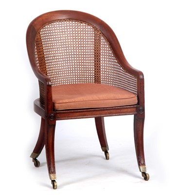 Lot 901 - A REGENCY MAHOGANY BERGERE LIBRARY CHAIR with...