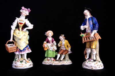 Lot 82 - A DRESDEN SEATED FLOWER SELLER DOUBLE FIGURE...