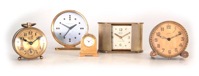 Lot 405 - A COLLECTION OF FIVE BRASS TRAVELLING CLOCKS...