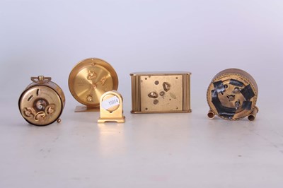 Lot 405 - A COLLECTION OF FIVE BRASS TRAVELLING CLOCKS...