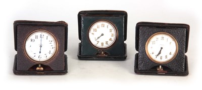 Lot 398 - A COLLECTION OF THREE TRAVELLING CLOCKS in...