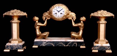 Lot 440 - AN ART DECO FIGURAL CLOCK GARNITURE the gilt...