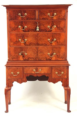 Lot 531 - AN EARLY 20TH CENTURY FIGURED WALNUT CHEST ON...