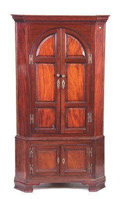 Lot 538 - A GEORGE III MAHOGANY STANDING CORNER CUPBOARD...