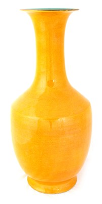 Lot 104 - A CHINESE YELLOW GLAZED VASE with trumpet neck,...