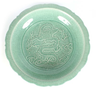 Lot 109 - AN EARLY CHINESE UNUSUALLY LARGE PALE GREEN...