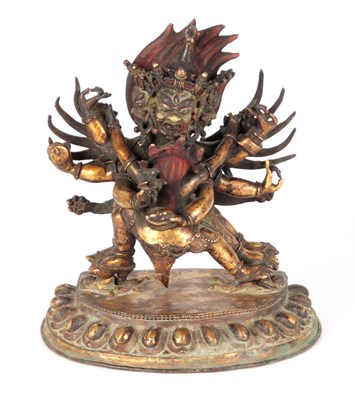 Lot 173 - AN EARLY TIBETAN BRONZE MANDKESVARA YAB YUM...