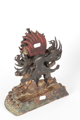 Lot 173 - AN EARLY TIBETAN BRONZE MANDKESVARA YAB YUM...