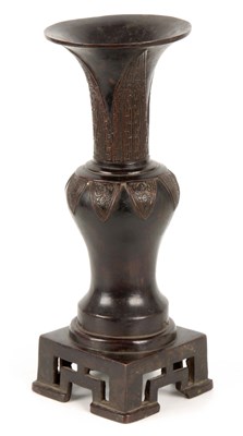 Lot 186 - AN EARLY CHINESE CAST BRONZE VASE having a...