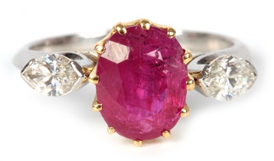 Lot 228 - A LADIES RUBY AND DIAMOND RING the oval ruby...