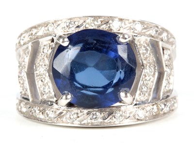 Lot 230 - AN 18CT WHITE GOLD SAPPHIRE AND DIAMOND RING...