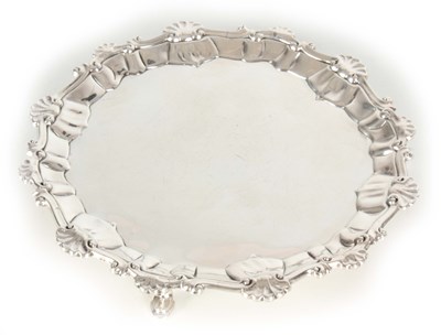 Lot 276 - A GEORGE III SILVER SALVER with raised shell...