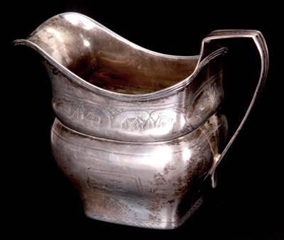 Lot 284 - A GEORGE III IRISH SILVER CREAM JUG of...