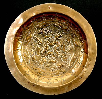 Lot 404 - A 17TH CENTURY CONTINENTAL BRASS ALMS DISH...