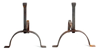 Lot 409 - A PAIR OF WROUGHT IRON FIRE DOGS with arched...