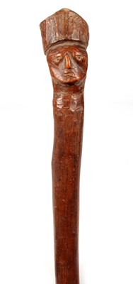 Lot 419 - A 19TH CENTURY AFRICAN STICK with carved mask...