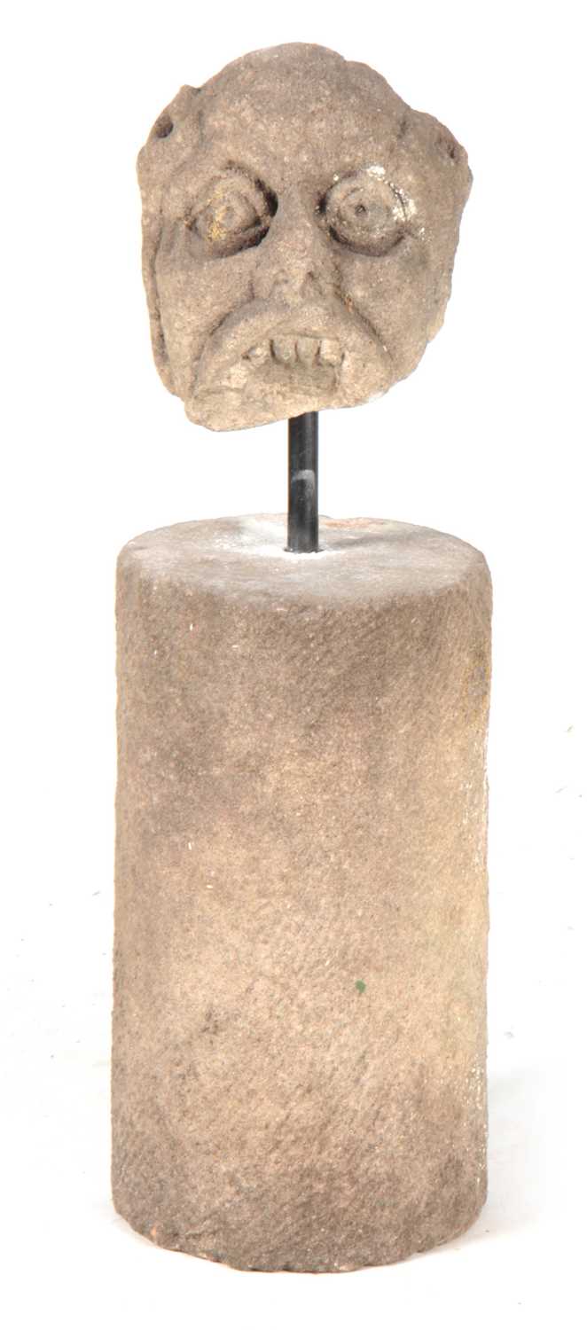 Lot 537 - AN EARLY CARVED STONE GARGOYLE HEAD modelled...