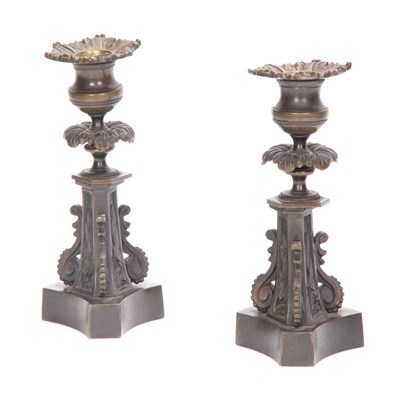 Lot 540 - A PAIR OF REGENCY BRONZE CANDLESTICKS with...