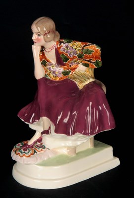 Lot 58 - A GOLDSCHIEDER HAND DECORATED SEATED FIGURE OF...