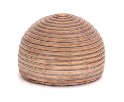 Lot 753 - A 19TH CENTURY TREEN BEEHIVE SHAPED DOORSTOP...