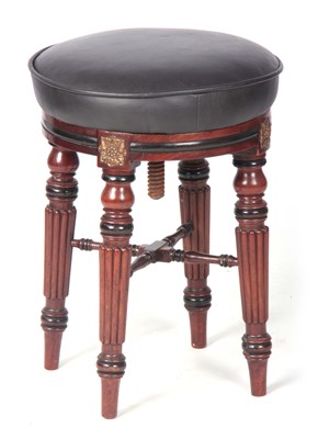 Lot 771 - A REGENCY MAHOGANY AND EBONISED REVOLVING...