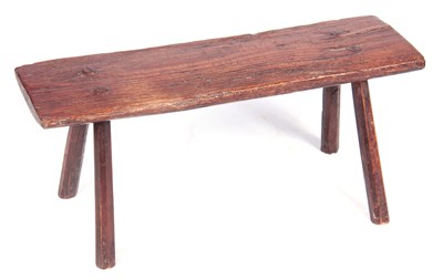 Lot 786 - A PRIMITIVE 18TH CENTURY ELM PIG BENCH raised...