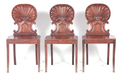 Lot 851 - A SET OF THREE REGENCY HALL CHAIRS IN THE...