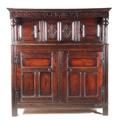 Lot 867 - A LATE 17TH CENTURY OAK DUODARN INITIALED AND...