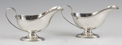 Lot 290 - A PAIR OF SILVER SAUCE BOATS with reeded loop...