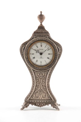 Lot 675a - AN EARLY 20TH CENTURY SILVER SWIZA ALARM CLOCK...