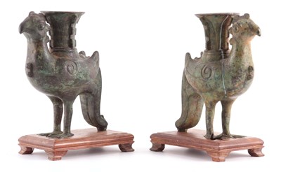 Lot 148 - AN EARLY PAIR OF CHINESE PATINATED BRONZE...