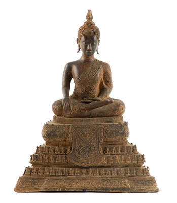 Lot 153 - AN EARLY TIBETAN CAST BRONZE SEATED BUDDHA...