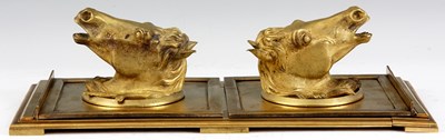 Lot 626 - A LATE 19TH CENTURY ORMOLU SLIDING BOOK STAND...