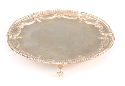 Lot 241 - A GEORGE III SILVER SALVER with reed-edged...