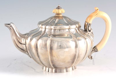 Lot 306 - A VICTORIAN SILVER AND IVORY TEAPOT of squat...