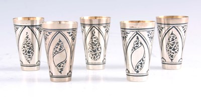 Lot 337 - A SET OF FIVE RUSSIAN SILVER NIELLO VODKA CUPS...